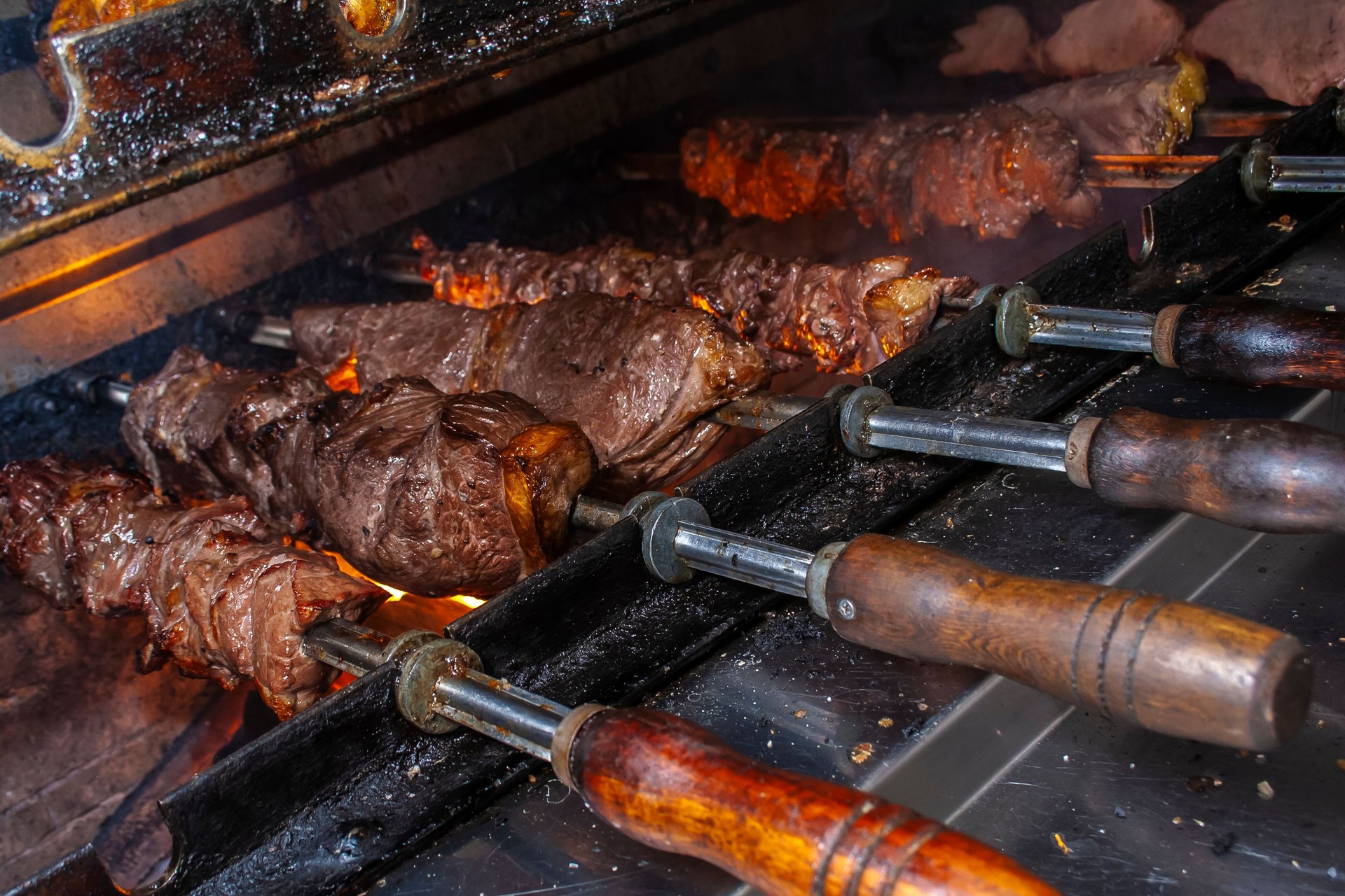 Brazilian style beef ribs Barbecue grill on skewers  at a churrascaria steakhouse